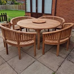 Teak garden dining table. 1.8m Titan round table with 4 bow wood style seats